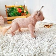 Realistic animal toy Bull Scotland wool yarn sculpture. Interior decor eco-style