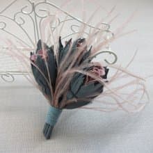 Leather brooch with a bouquet of roses and ostrich feathers