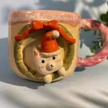 Handmade ceramic cup. Handmade ceramic mug with cute Santa cat pattern. for gifts