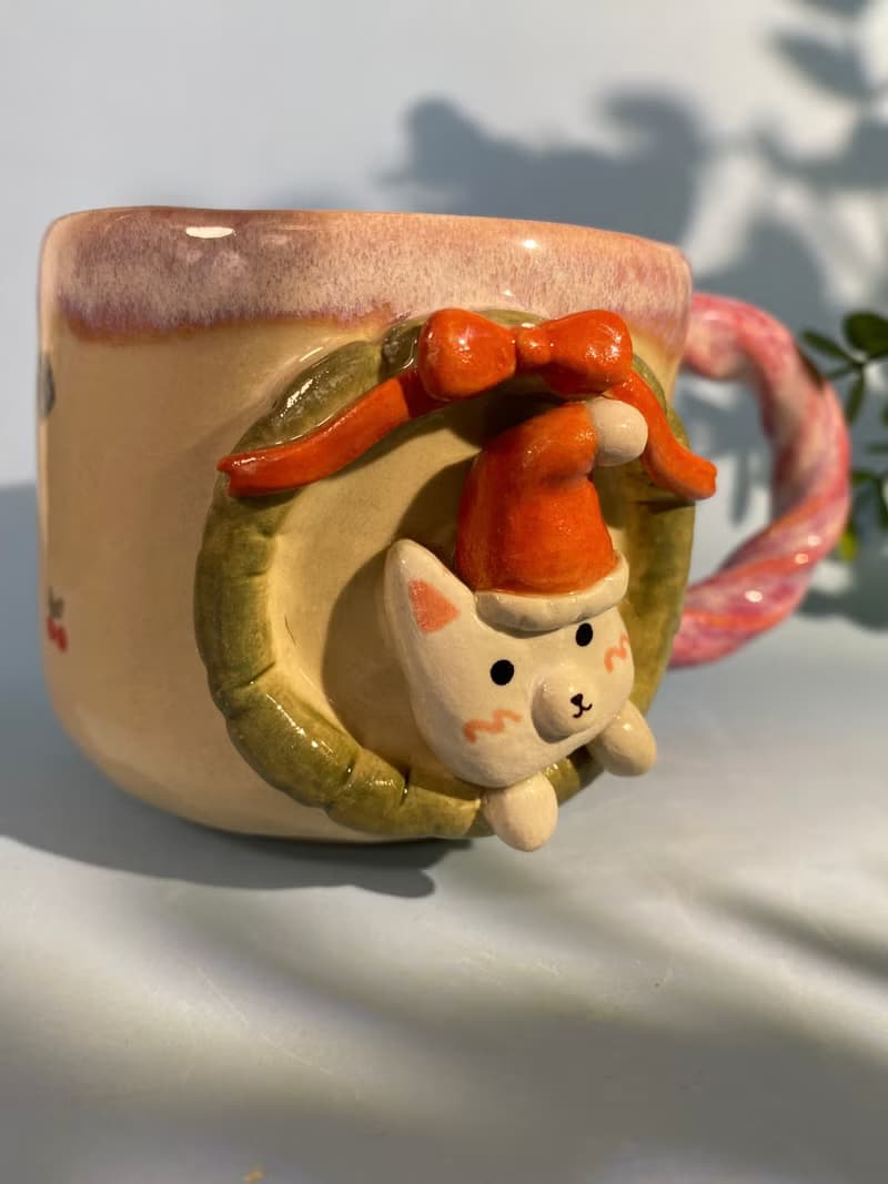 Handmade ceramic cup. Handmade ceramic mug with cute Santa cat pattern. for gifts