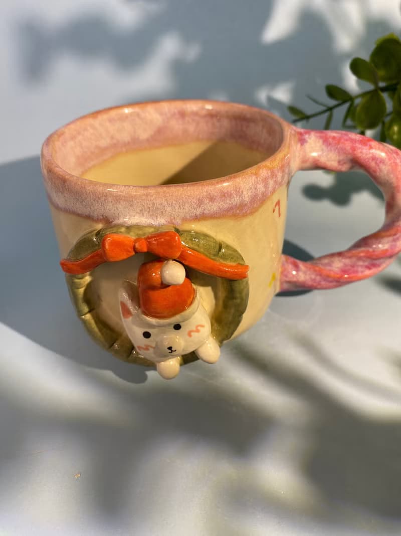 Handmade ceramic cup. Handmade ceramic mug with cute Santa cat pattern. for gifts