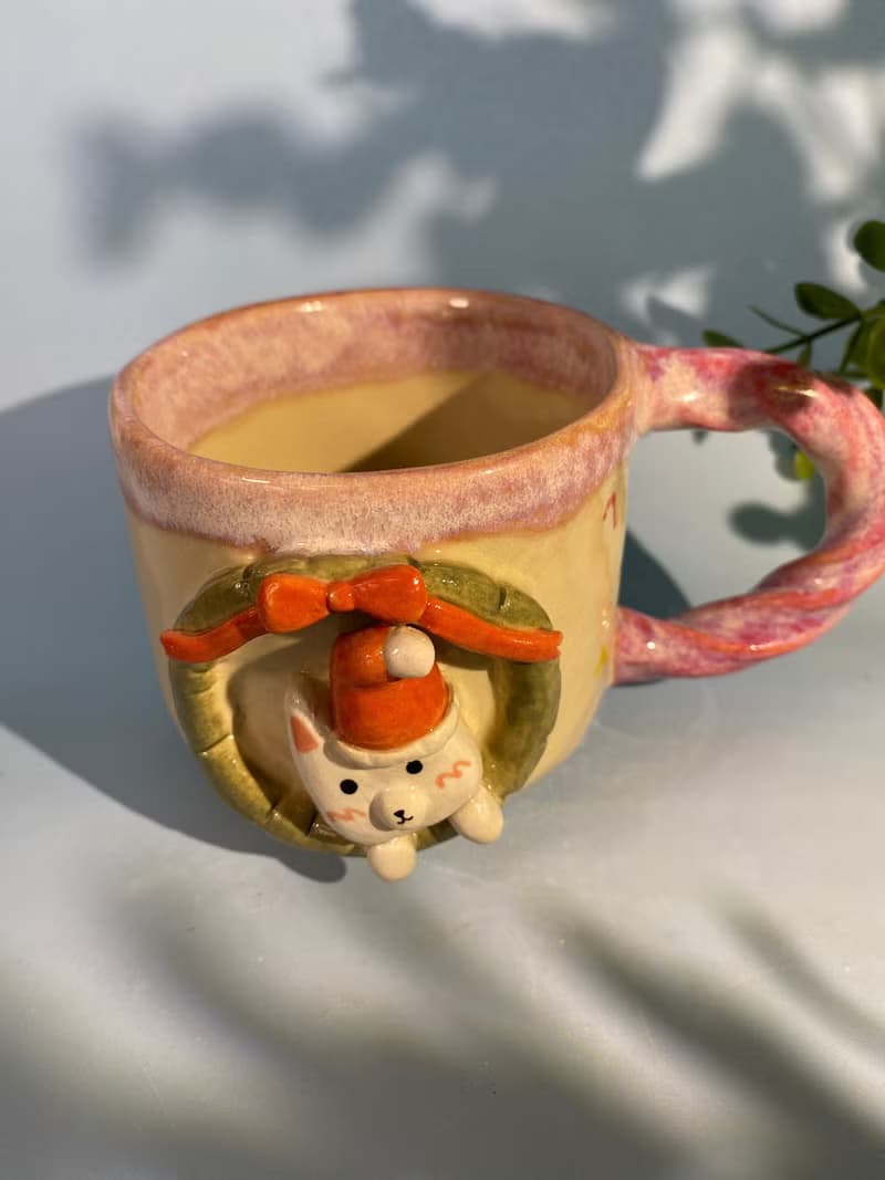 Handmade ceramic cup. Handmade ceramic mug with cute Santa cat pattern. for gifts