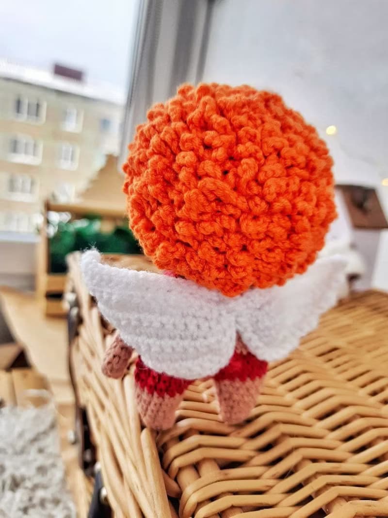 Little angel with red hair gift to parents on the birth of baby. Valentine's Day