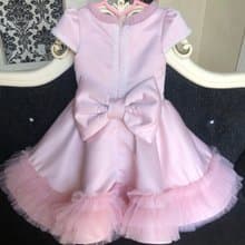 Pink dress with pearl, big bow on the back and bow clip for hear. Birthday dress