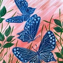 White-blue butterflies against the backdrop of fiery sunset.