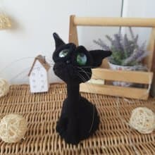 Interior cat toy sculpture . Knitting sitting realistic pet replica. Cat toy