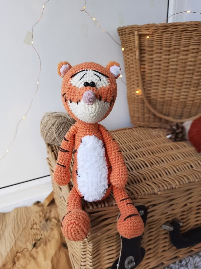 Soft orange tiger cub Disney cartoon character. Stuffed animal tiger soft toy