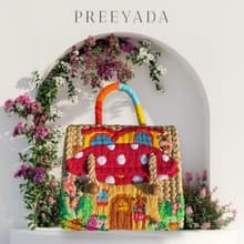 Water hyacinth bag embroidered with red mushroom house pattern