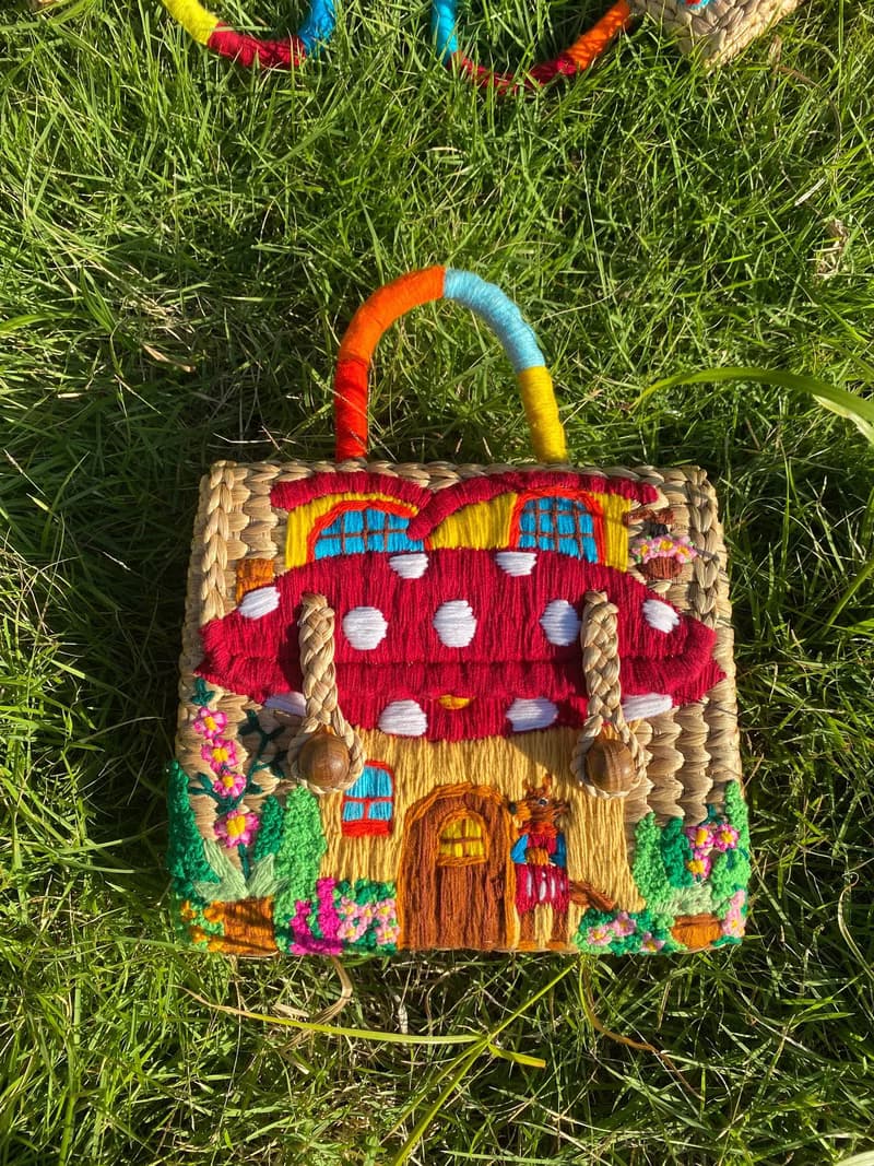 Water hyacinth bag embroidered with red mushroom house pattern