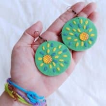 Cute free-form dangle earrings design with hand-stitching on hard felt, beads