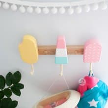 Clothes and towel hanger for nursery with wooden ice cream hooks