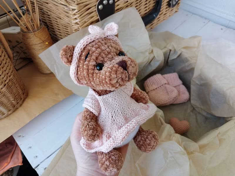 Teddy bear and booties baby gift for mom.Teddy bear in a pink dress pink shoes