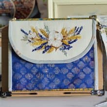 Handmade needles-and-tools organizer with hand cross stitched bouquet