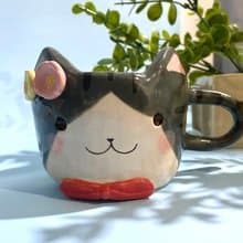 Handmade ceramic cup. Handmade ceramic mug with cute cat and flower lover for gifts.