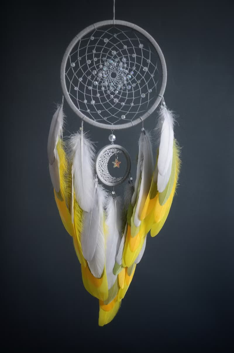 Handcrafted Dream Catcher with Sparkling Crystals and Vibrant Yellow Feathers