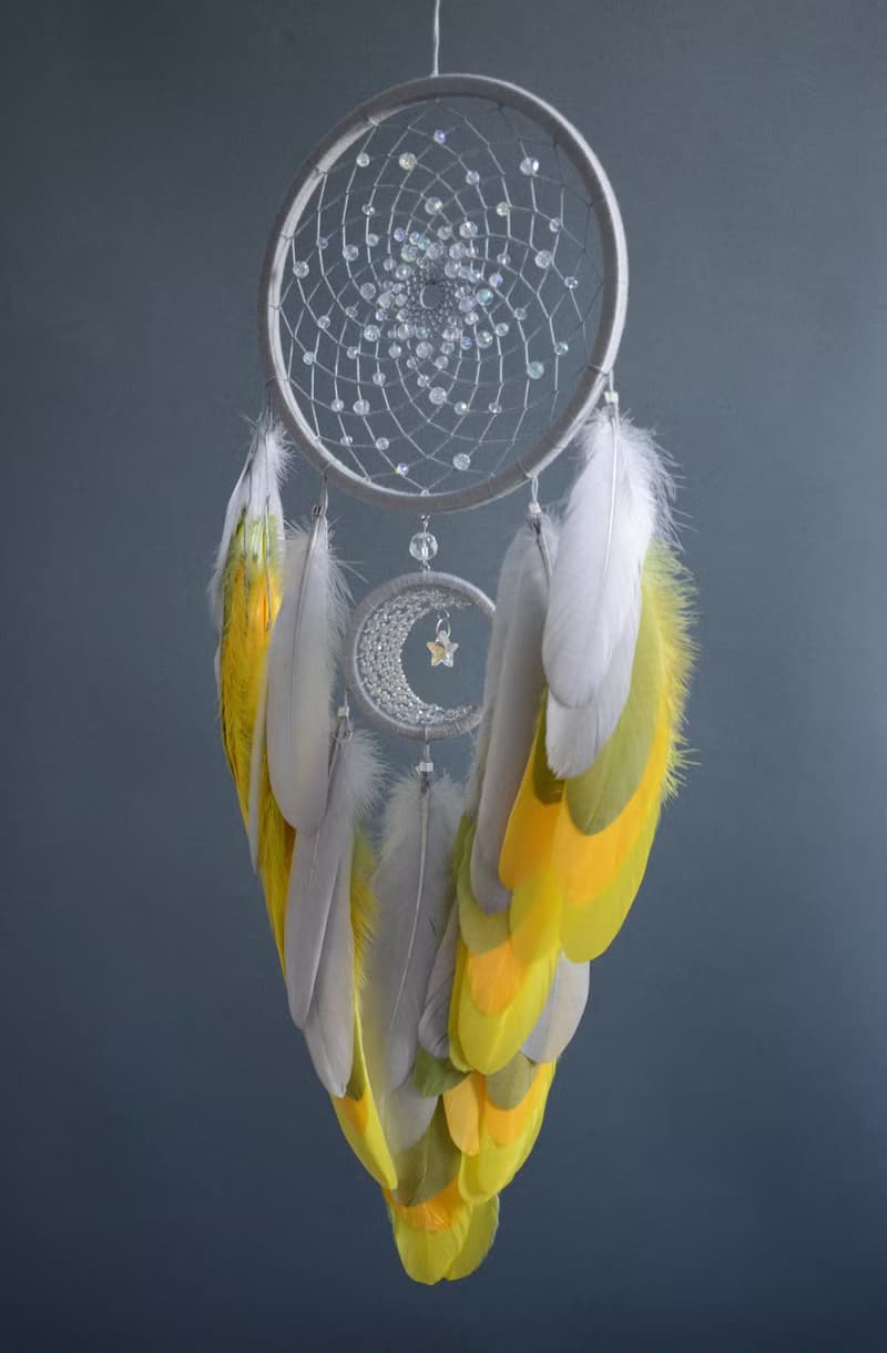 Handcrafted Dream Catcher with Sparkling Crystals and Vibrant Yellow Feathers