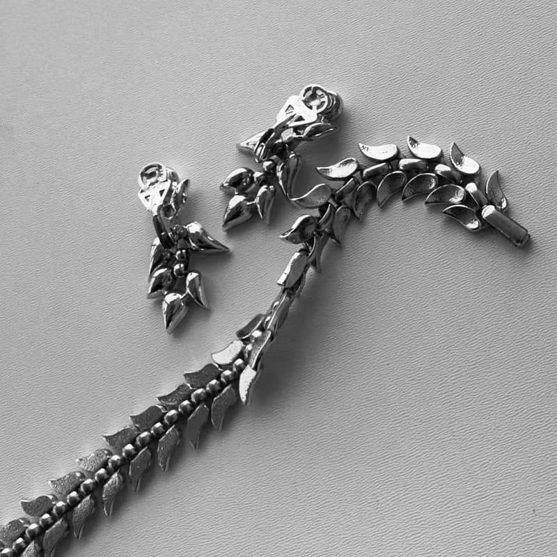Vintage Crown Trifari set clipon earrings and bracelet silver tone 1950 patent