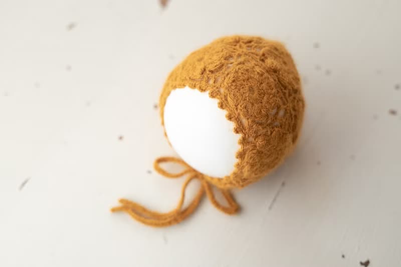 Orange hat for newborn girls:the perfect outfit for a little girl