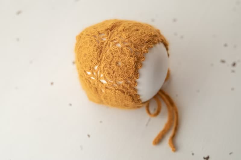 Orange hat for newborn girls:the perfect outfit for a little girl
