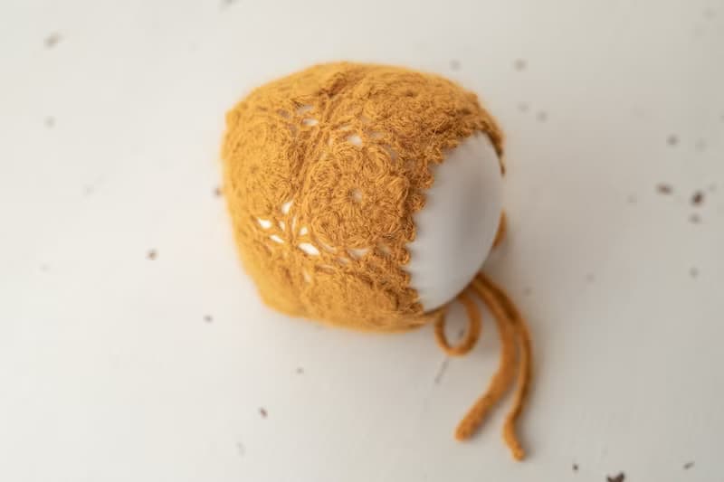 Orange hat for newborn girls:the perfect outfit for a little girl