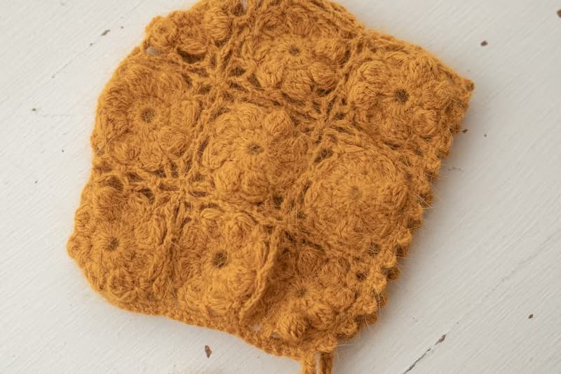 Orange hat for newborn girls:the perfect outfit for a little girl