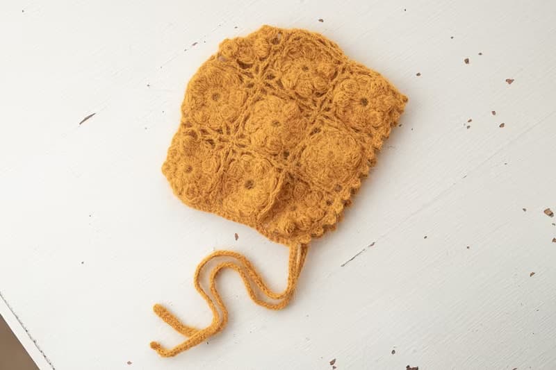Orange hat for newborn girls:the perfect outfit for a little girl
