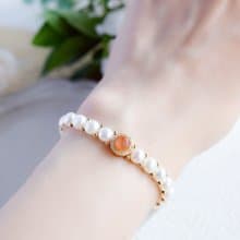 成功へと導いてくれる　キスミー　サンストーンとバロックパールの手編みブレスレット 5月/6月誕生石