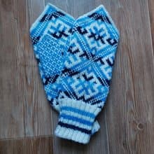 Women's and men's hand-knitted wool mittens are very warm with a pattern