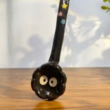 Handmade ceramic spoon with black dust from Totoro.