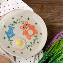 Plate with bear, egg, fish pattern