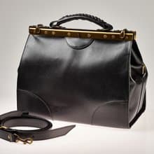 Black vegetable-tanned leather old frame western bag.