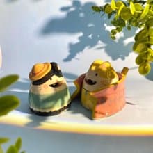 Cute handmade ceramic dolls for home decoration.