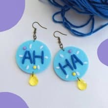 Handmade colorful free-form earrings with hand-stitching on felt with beads