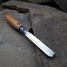 Forged  V-chisel. Woodworking tool. Woodcarving chisel.