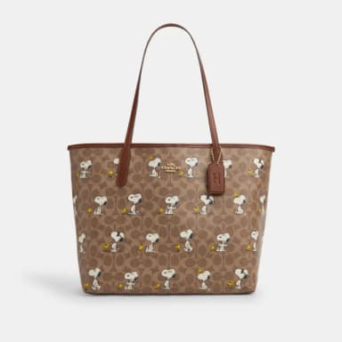 【COACH】蔻馳官方直營 COACH X PEANUTS CITY經典Logo SNOOPY印花托特手袋-IM/棕黃色/棕色 混合色(CBJ89)