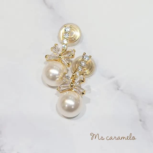 【Ms caramelo 焦糖小姐】夾式耳環 貝珠蝴蝶結耳環(鋯石耳環)