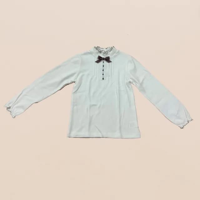 【ANNY’S 安妮公主】童裝 典雅荷葉邊造型蝴蝶結秋冬款花瓣邊長袖上衣(3441白色)