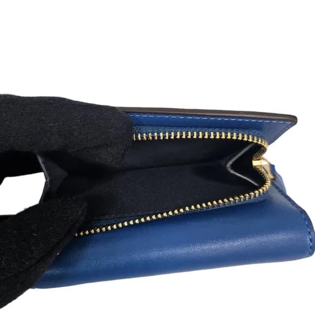 【COACH】經典馬車LOGO三折釦式短夾多色可選(拉鍊零錢包/三折短夾/贈原廠紙袋紙盒)