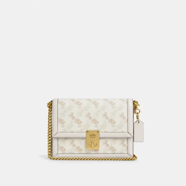 【COACH】蔻馳官方直營 HUTTON馬車圖案印花單肩手袋 單肩包 肩背包-B4/粉筆白色 混合色(CZ318)