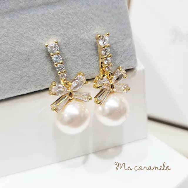 【Ms caramelo 焦糖小姐】夾式耳環 貝珠蝴蝶結耳環(鋯石耳環)