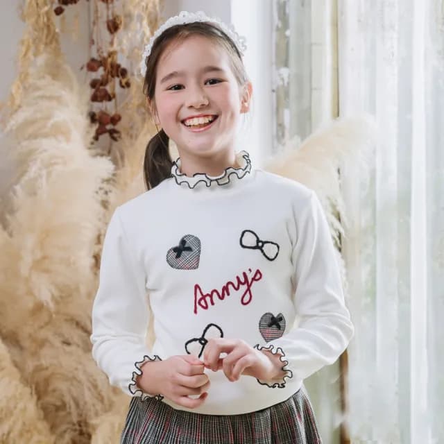 【ANNY’S 安妮公主】童裝   ANNY’S 安妮公主 愛心蝴蝶結插畫荷葉領造型秋冬款長袖上衣(3438白色)