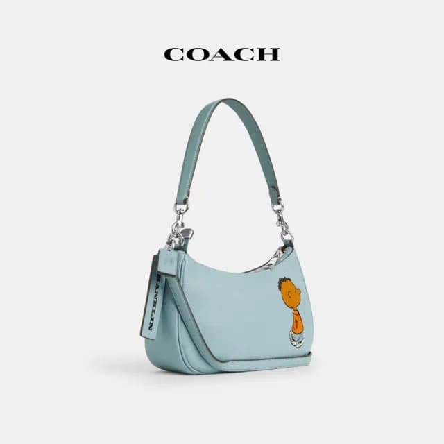 【COACH】蔻馳官方直營 COACH X PEANUTS TERI FRANKLIN圖案單肩手袋-SV/淺藍色 混合色(CBJ80)