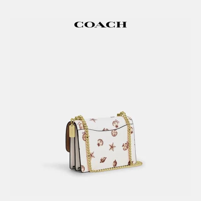 【COACH】蔻馳官方直營 KLARE貝殼印花迷你斜背手袋 斜背包 側背包 斜挎包-IM/粉筆白色 混合色(CBI18)