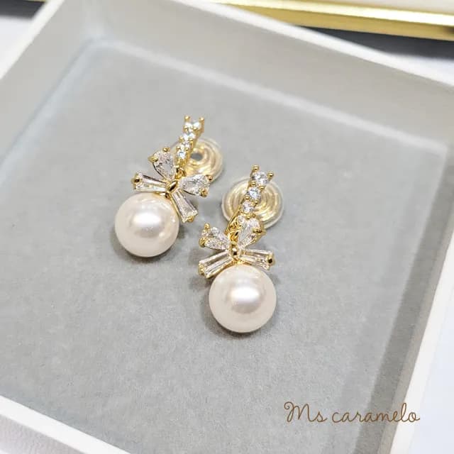 【Ms caramelo 焦糖小姐】夾式耳環 貝珠蝴蝶結耳環(鋯石耳環)